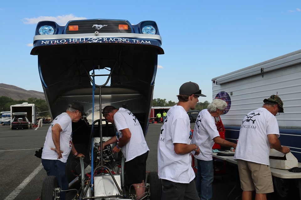 crew of pop bang boom injected nitro funny car