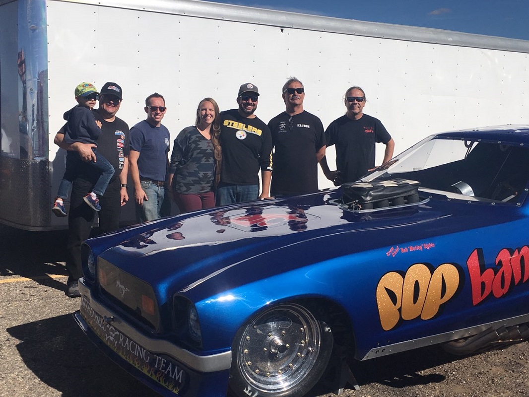 crew of pop bang boom injected nitro funny car at albuquerque dragway